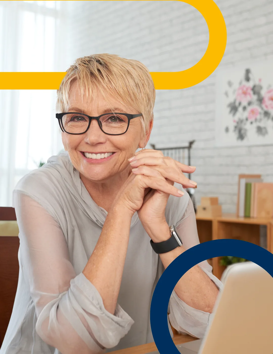 A person smiling at their laptop, framed in the Pensions Awareness Week brand shapes